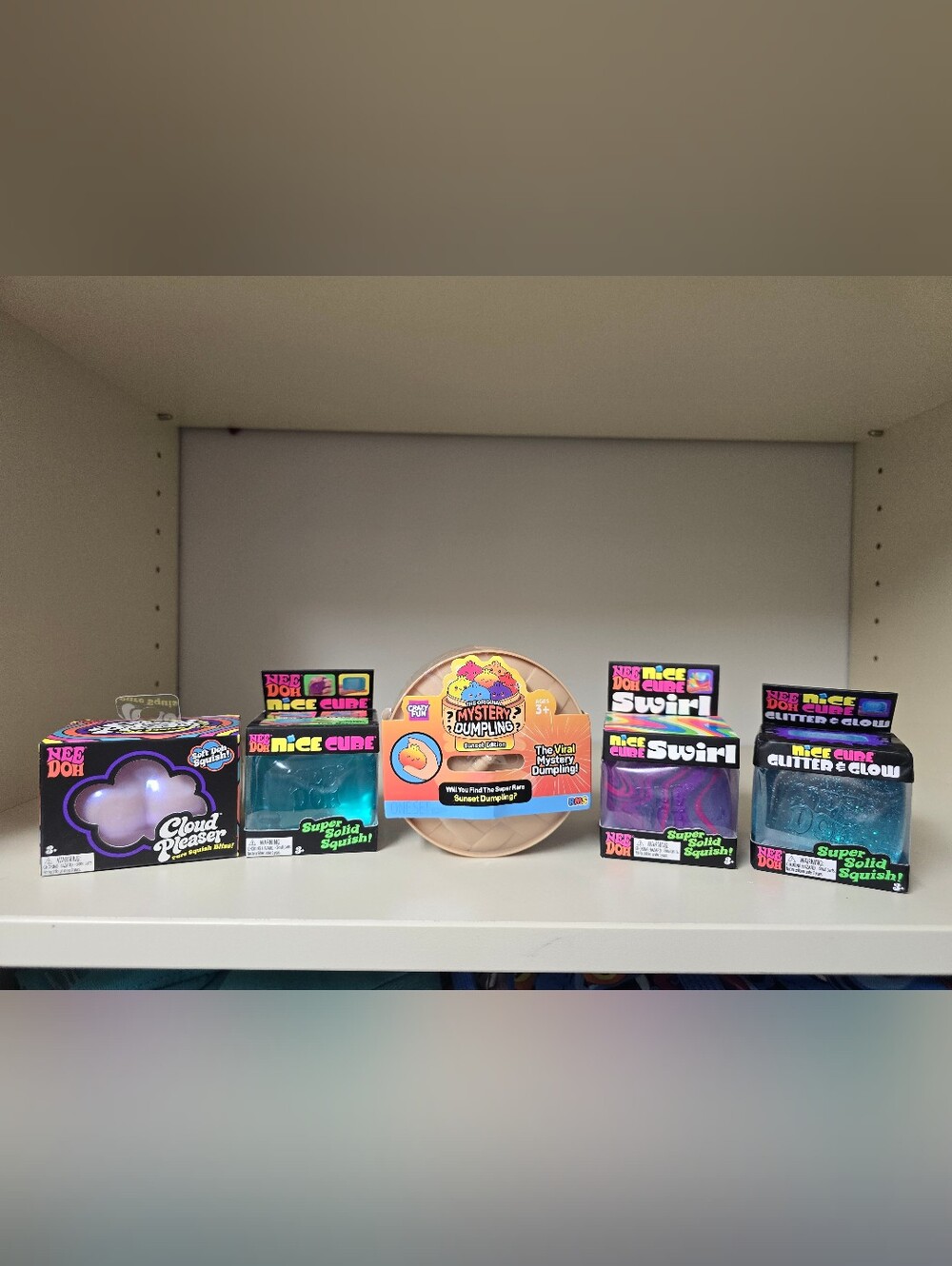 Original Mystery Dumpling Sunset Edition + Nee Doh Squish Toys.